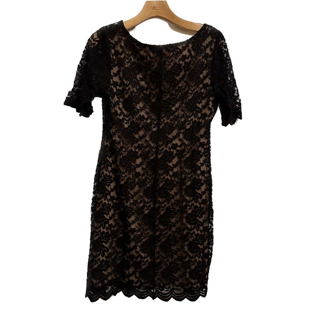 Beautiful black lace sheath dress with tan lining.  Size 10P